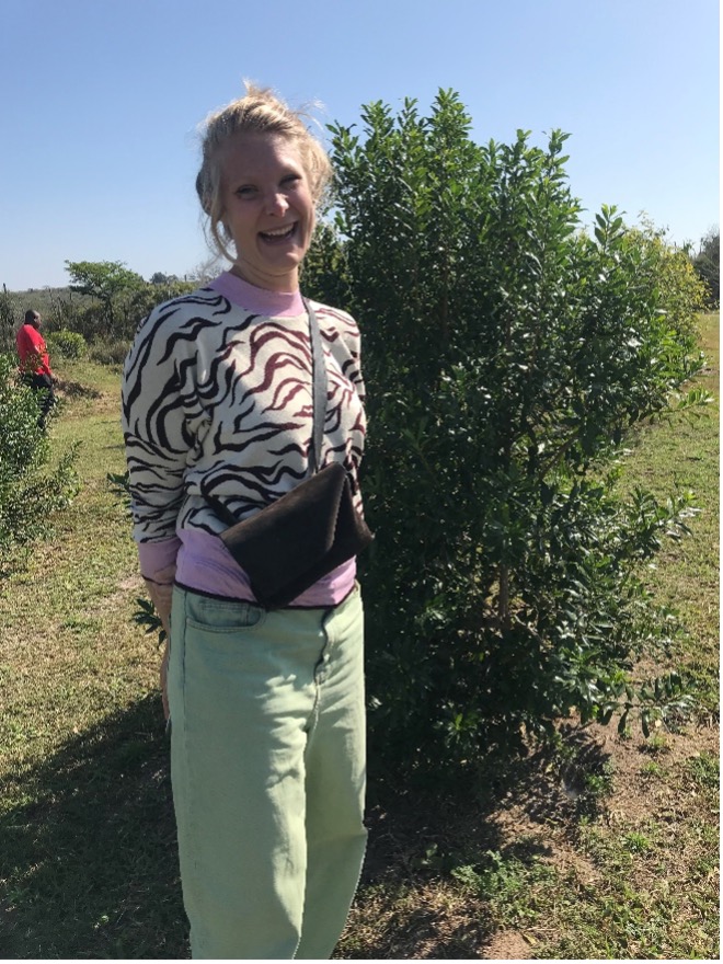 Dr Reitsma standing next to a pepper-bark tree planted within the University of Eswatini’s farm as part of the conservation efforts by the Institute.